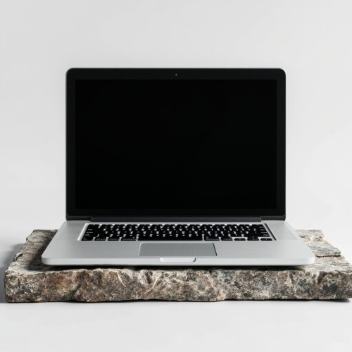 Silver-Laptop-on-Stone-Slab-with-Black-Screen_IJ9wK Silver-Laptop-on-Stone-Slab-with-Black-Screen_IJ9wK